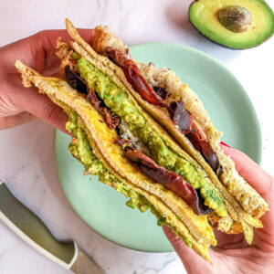 Avocado egg sandwich with crispy bacon